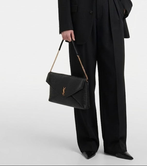 Saint Laurent Cassandre Large envelope leather clutch with YSL model